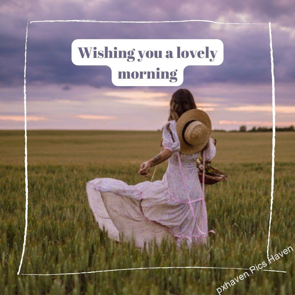 Beautiful Good Morning Images and quotes.HD image free download. a girl with pink dress hat and open hair standing fields lavender sky wishing you a lovely morning