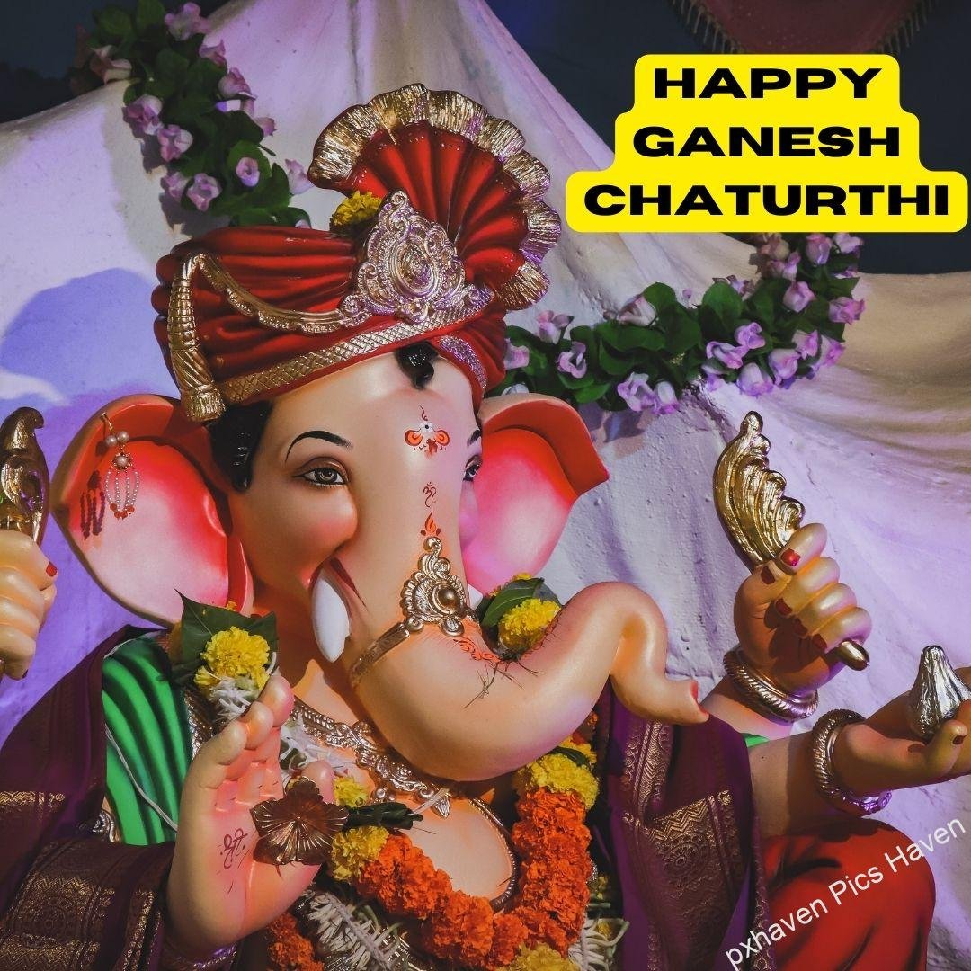 A beautiful idol of Lord Ganesha with roses and flowers decoration giving blessings. Happy Ganesh Chaturthi. free download. HD image. Happy Ganesh Chaturthi wishes. quotes.