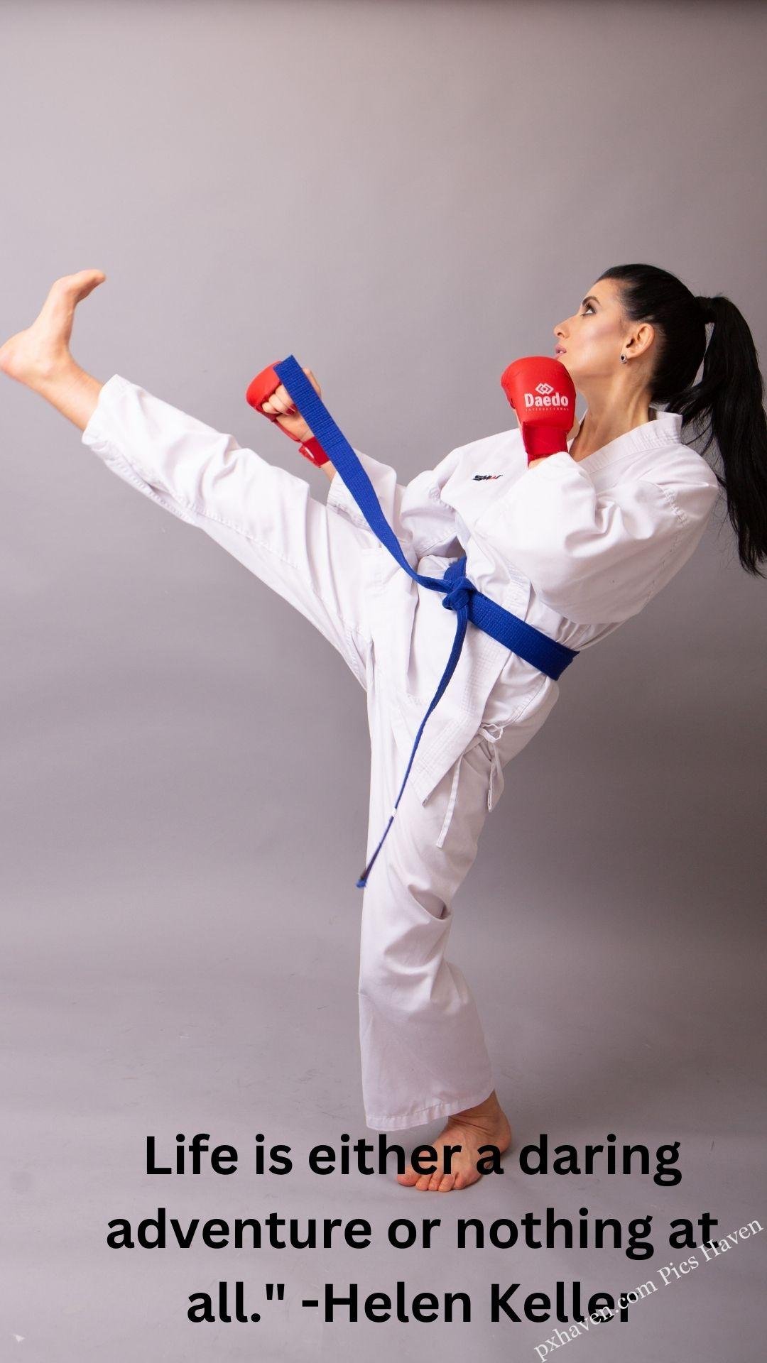 A woman or girl practicing karate Taikwondo. Life is either a daring adventure or nothing at all." -Helen Keller. Whatsapp status. Motivation quotes. HD image. Free download.