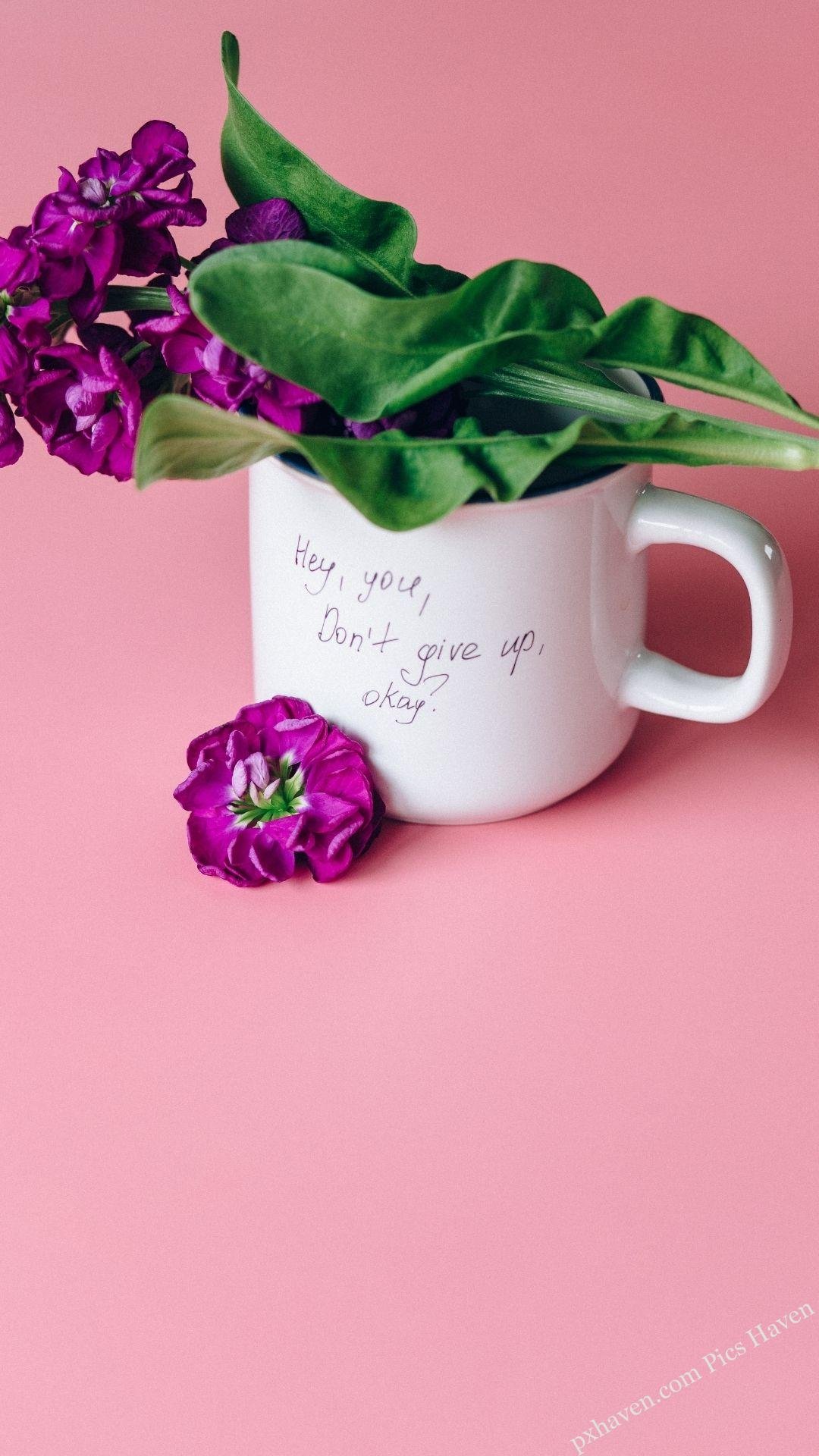 Whatsapp status. Motivation quotes. HD image. Free download. A cup with flowers in it.