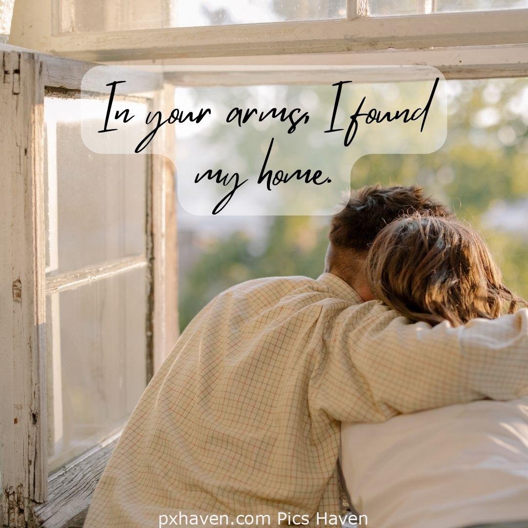 In your arms, I found my home. Aboy and girl, sitting and hugging hand on a window. Love Quotes and Images for Couples. HD images. Free download.