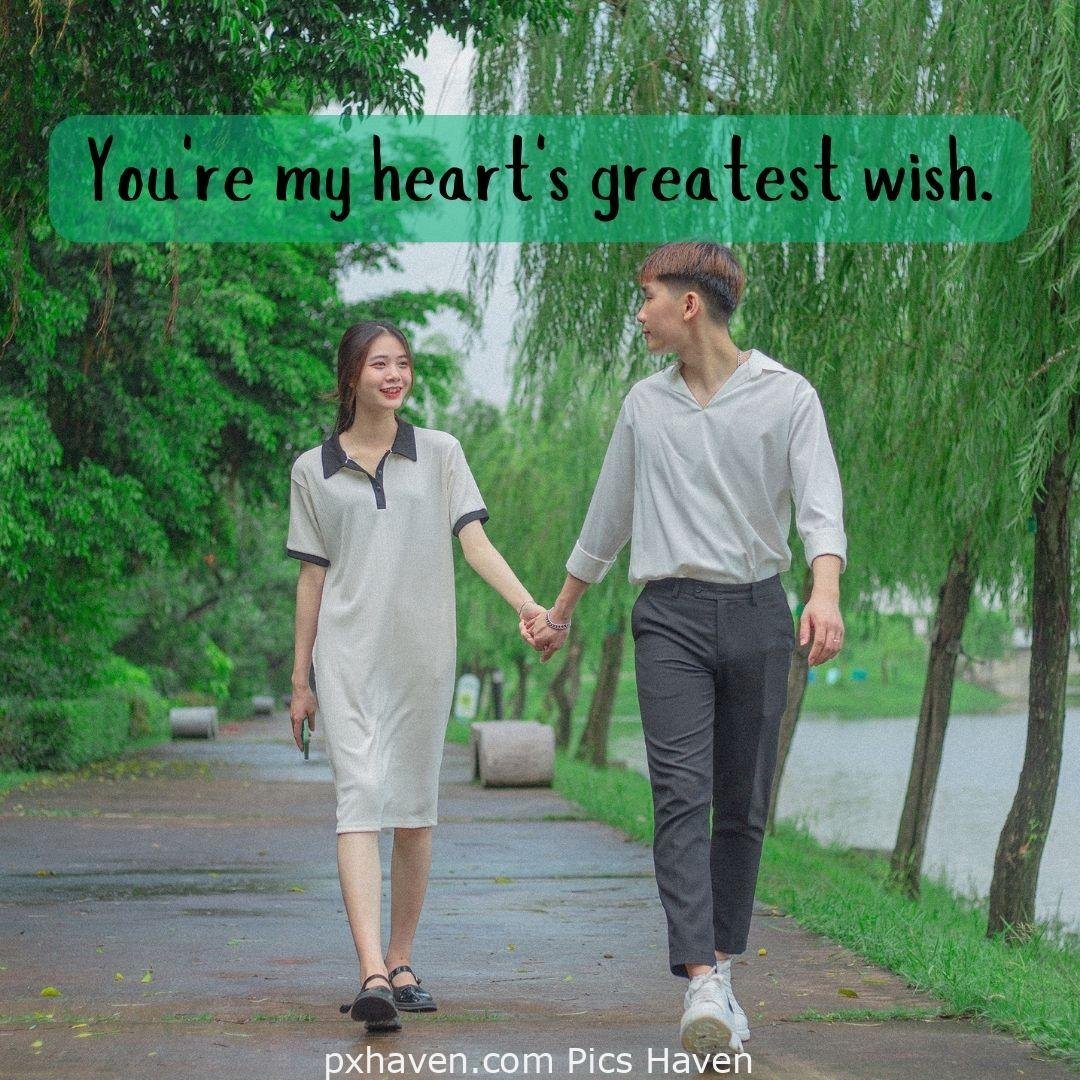 You're my heart's greatest wish. A girl and boy talking holding hands in relationship and love. romantic couple images and quotes. Love Quotes and Images for Couples. HD images. Free download.