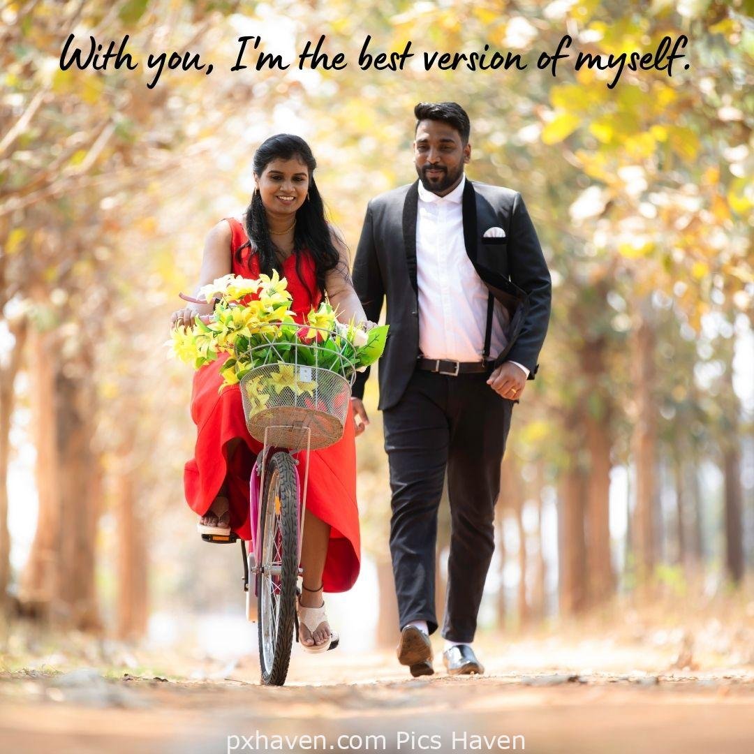 With you I am the best version of myself. A girl and boy talking and the girl in red dress riding a bicycle and love. romantic couple images and quotes. Love Quotes and Images for Couples. HD images. Free download.