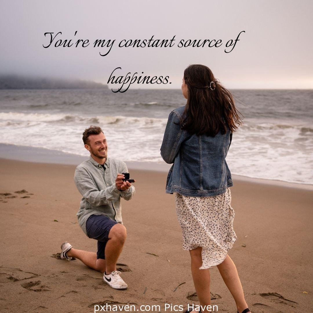 You're my constant source of happiness. A girl and boy talking. Boy proposing the girl in relationship and love. romantic couple images and quotes. Love Quotes and Images for Couples. HD images. Free download.