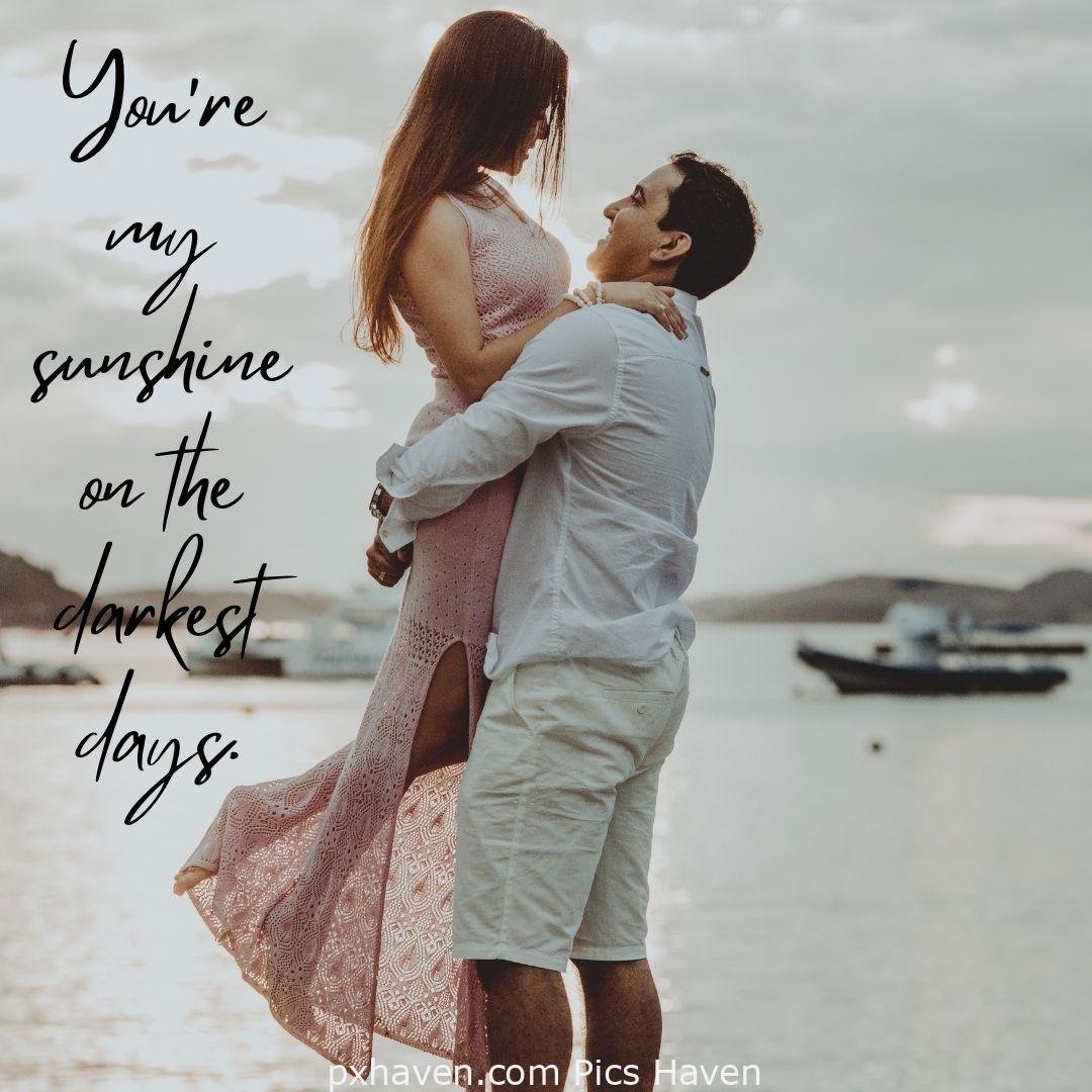 You are my sunshine on the darkest days. A man and woman, playing and dancing by the sea. Love Quotes and Images for Couples. HD images. Free download.