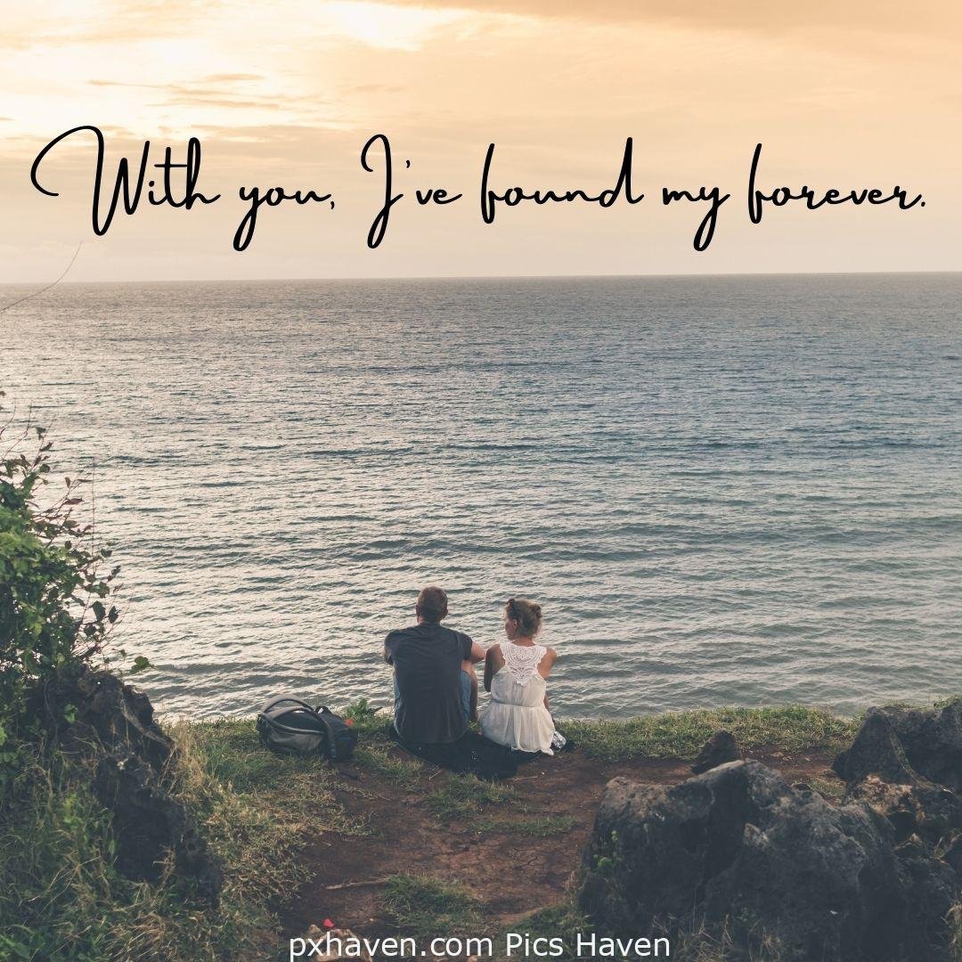 With you, I have found my forever. A boy and girl, sitting with each other early morning by the sea. Love Quotes and Images for Couples. HD images. Free download.