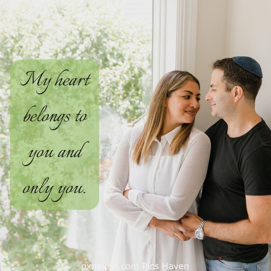 My heart belongs to you and only you. A boy and girl, standing together smiling and talking. Love Quotes and Images for Couples. HD images. Free download.