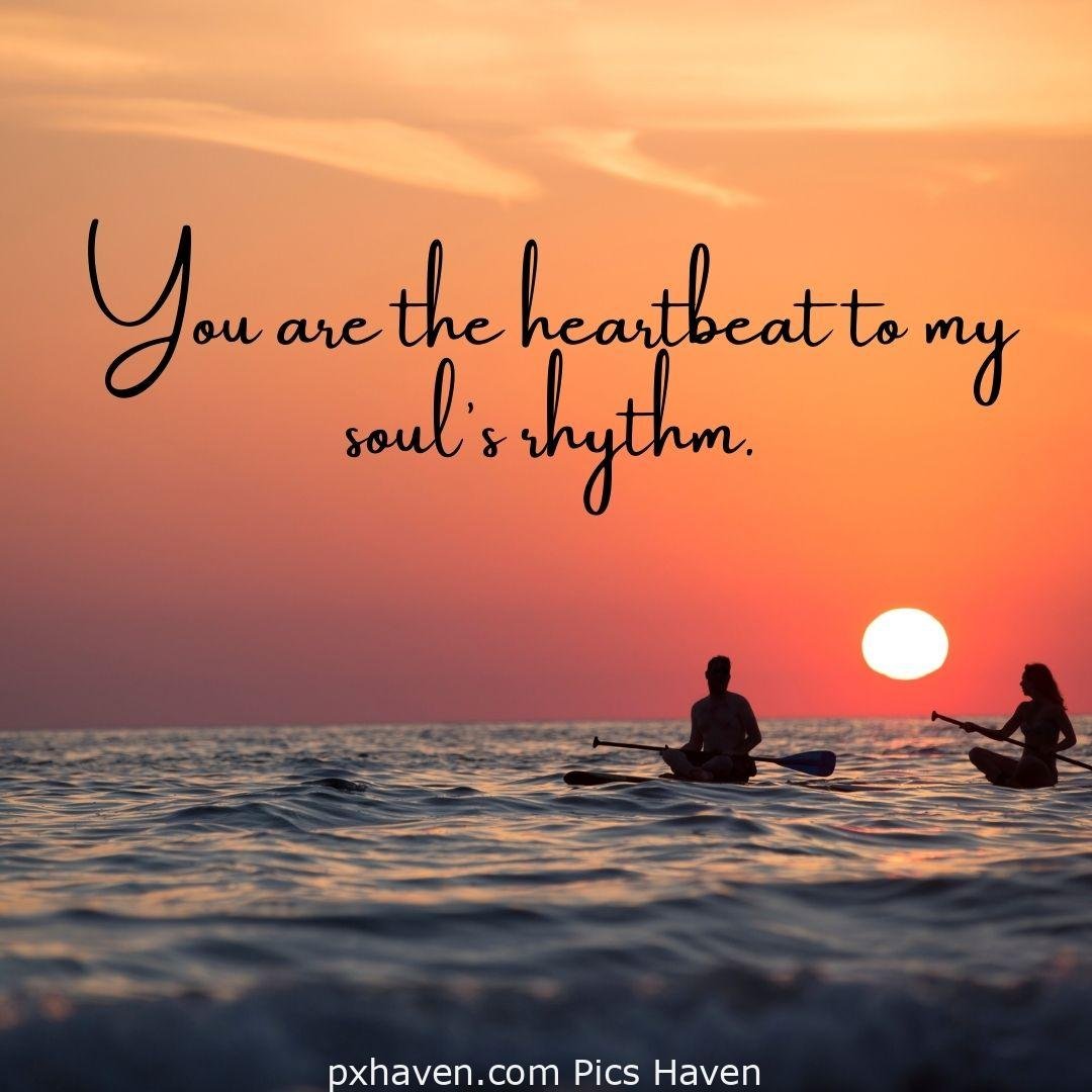 You are the heartbeat to my soul's rhythm. A man and woman, sitting together and talking rowing boat on water. Love Quotes and Images for Couples. HD images. Free download.