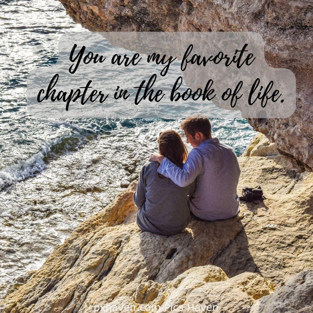 You are my favourite chapter in the book of life. A boy and girl, sitting together and talking hand in hand. Love Quotes and Images for Couples. HD images. Free download.