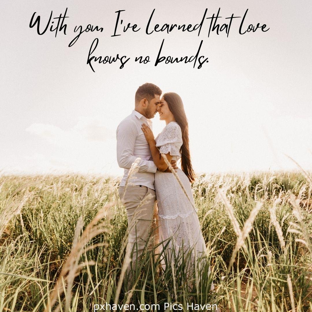 With you, I've learned that love knows no bounds. A man and woman hugging and kissing sitting hand in hand. Love Quotes and Images for Couples. HD images. Free download.