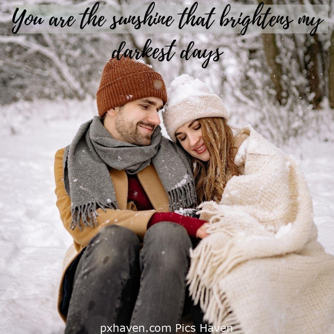 You are the sunshine that brightens my darkest days. A man and woman hugging and talking and sitting hand in hand in greenery. Love Quotes and Images for Couples. HD images. Free download.