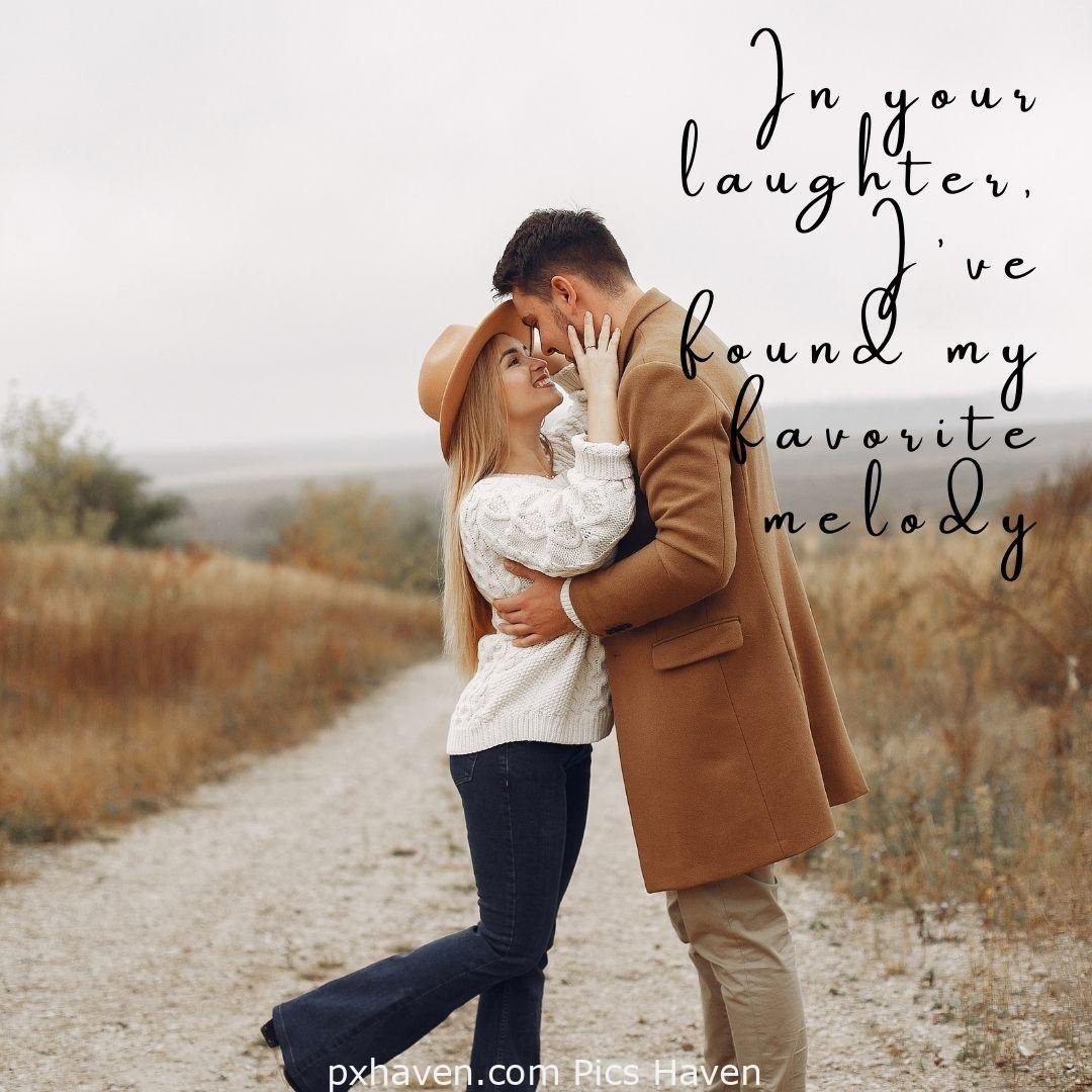 In your laughter, I've found my favourite melody. a man and woman hugging and walking hand in hand in greenery. Love Quotes and Images for Couples. HD images. Free download.