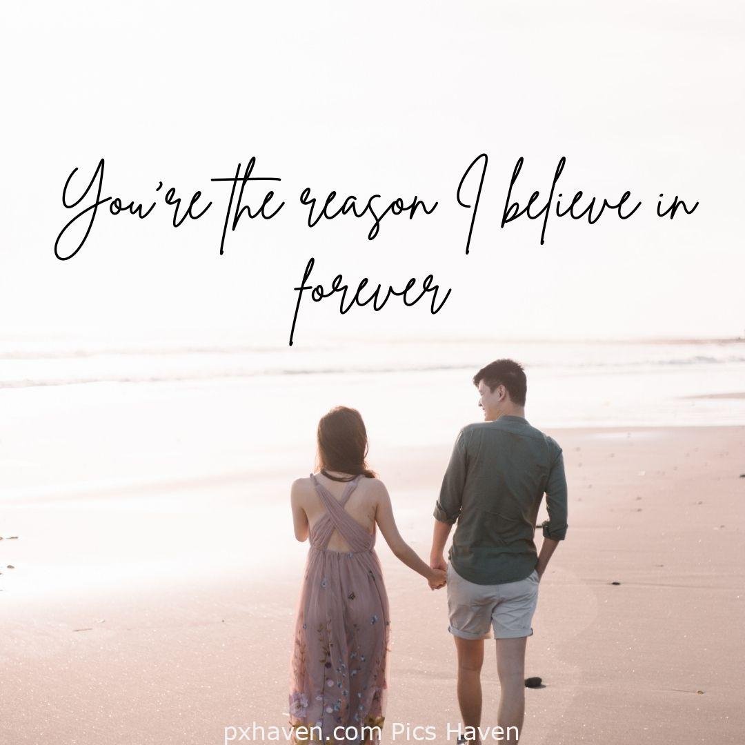 you are the reason I believe in forever. a man and woman walking hand in hand by sea side. Love Quotes and Images for Couples. HD images. Free download.