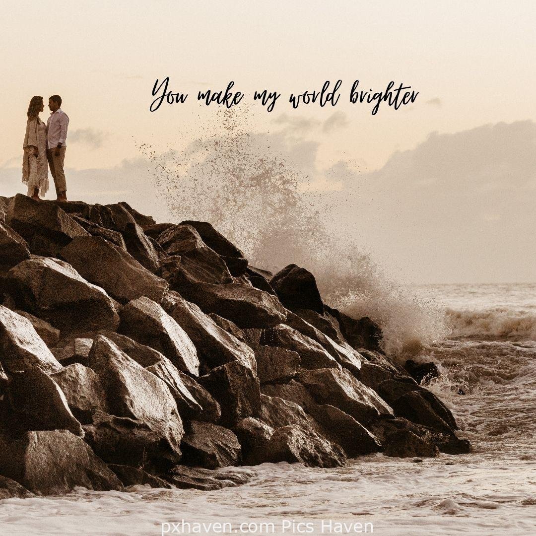 You make my world brighter. A girl and boy playing together on mountain top. Love Quotes and Images for Couples. HD images. Free download.