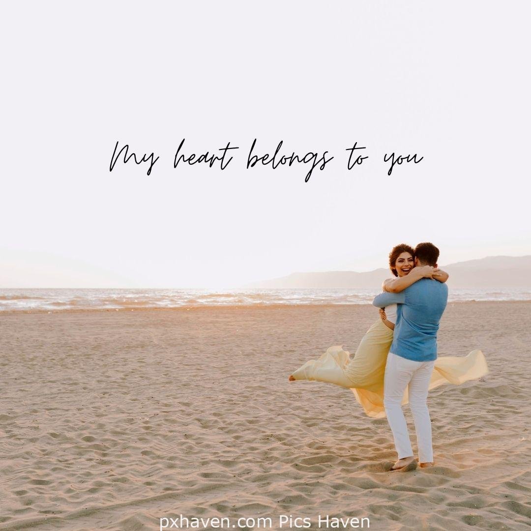 My heart belongs to you. A girl and boy together playing together on sand near the sea. Love Quotes and Images for Couples. HD images. Free download.