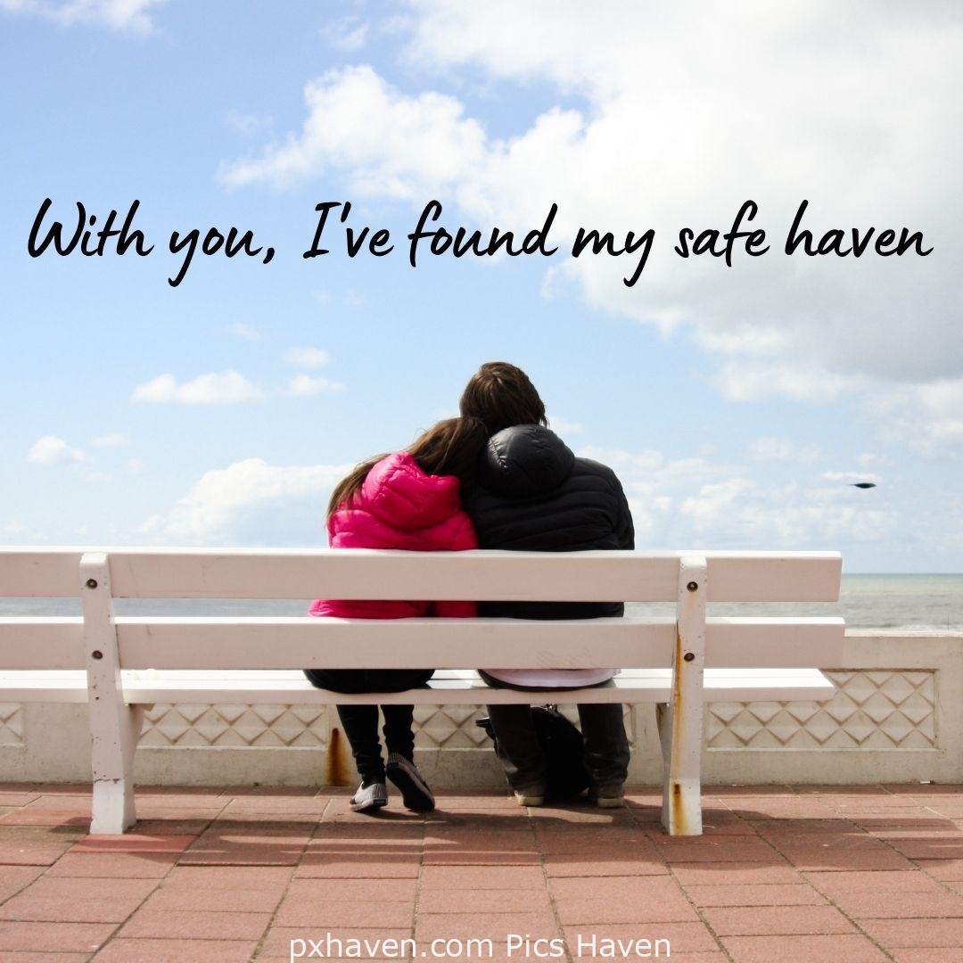 with you, I've found my safe haven. A boy and girl sitting with her man on a bench on the sea shore. relationship and love. romantic couple images and quotes. Love Quotes and Images for Couples. HD images. Free download.