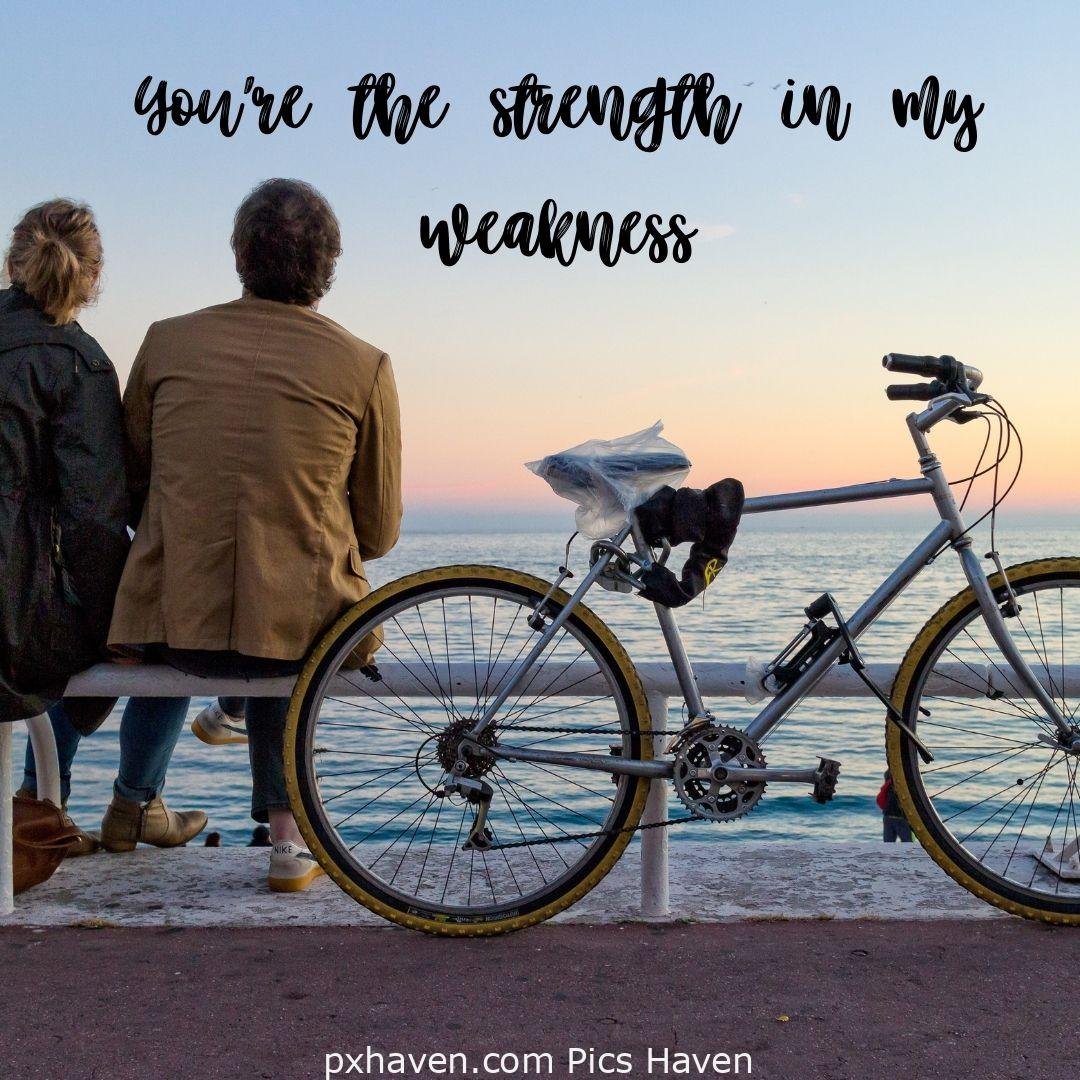 You're the strength in my weakness. A boy and girl sitting and talking near sea shore. relationship and love. romantic couple images and quotes. Love Quotes and Images for Couples. HD images. Free download.