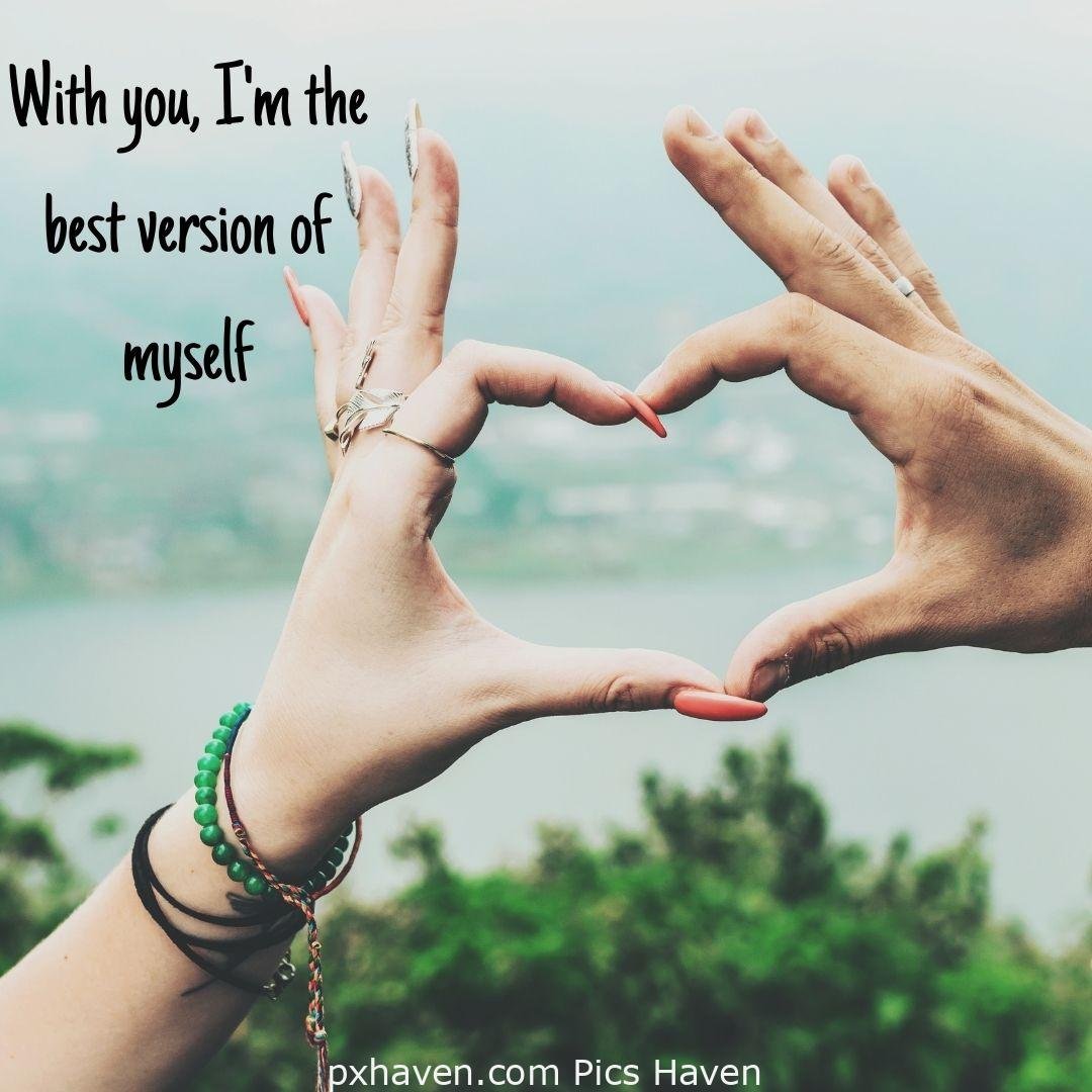 With you, I'm the best version of myself. A boy and girl making heart with their hands relationship and love. romantic couple images and quotes. Love Quotes and Images for Couples. HD images. Free download.