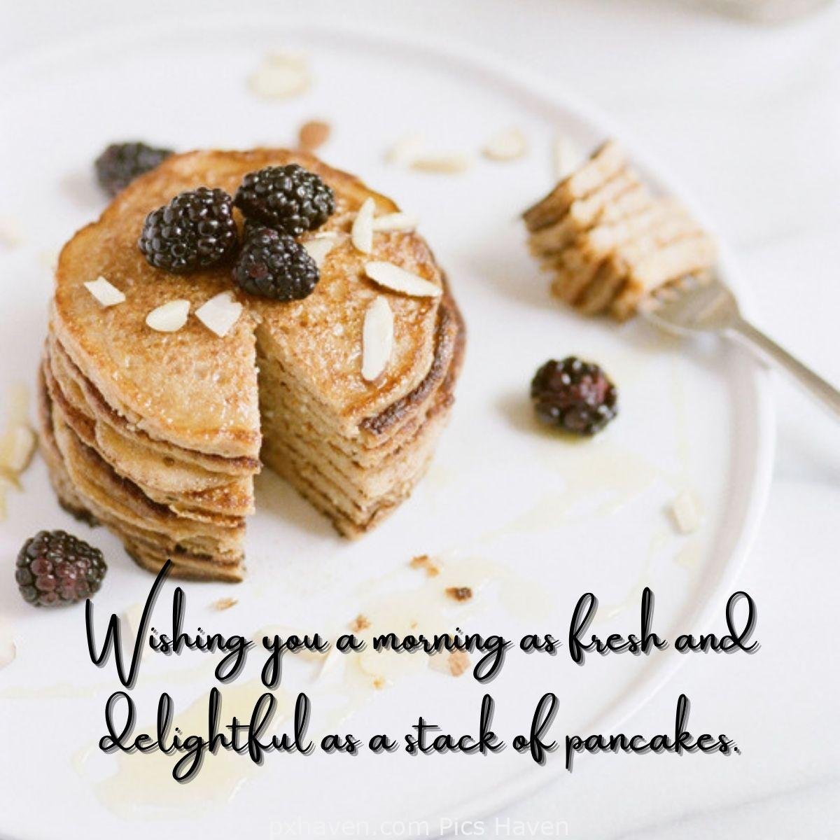 Good Morning breakfast quotes, free images wallpaper, free download. A plate of pancakes with raspberries. Wishing you a morning as fresh and delightful as a stack of pancakes.